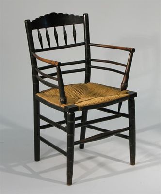 Appraisal: A Sussex ebonised wood armchair probably retailed by Morris Co