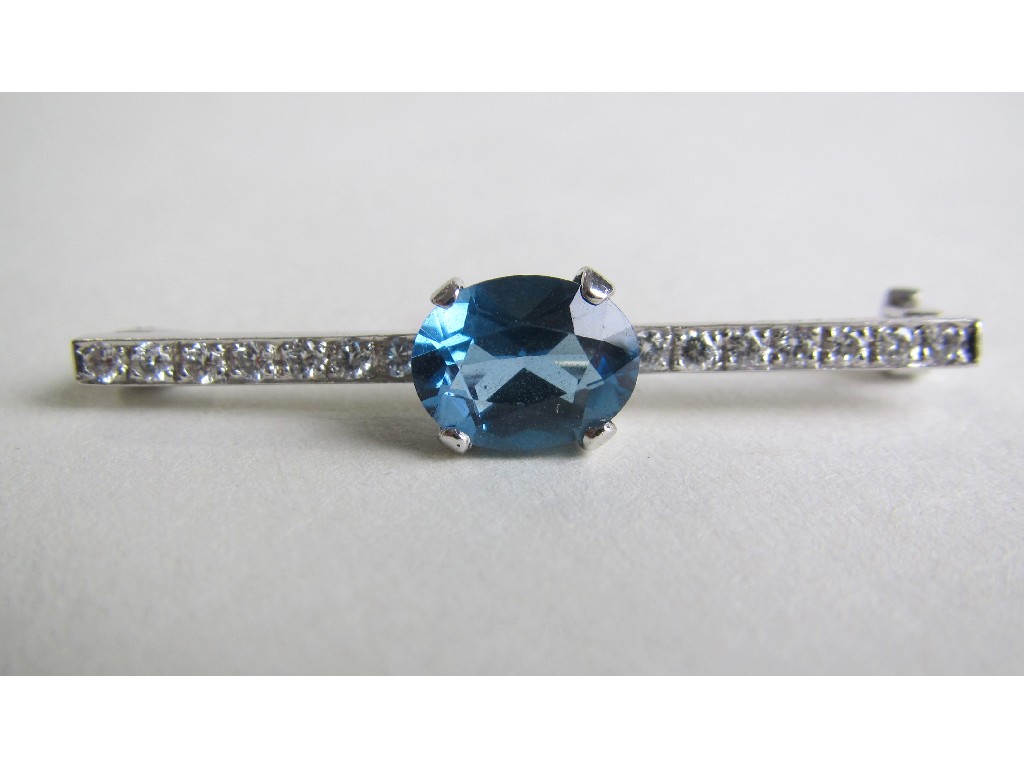 Appraisal: Eighteen carat white gold blue topaz and diamond set bar