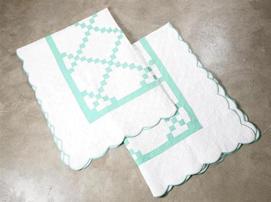 Appraisal: TWO QUILTS Green on white block pattern and scalloped edges