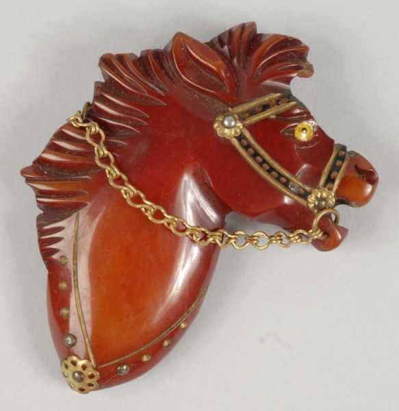 Appraisal: Bakelite Horse with Glass Eye Pin Description Original metal chain