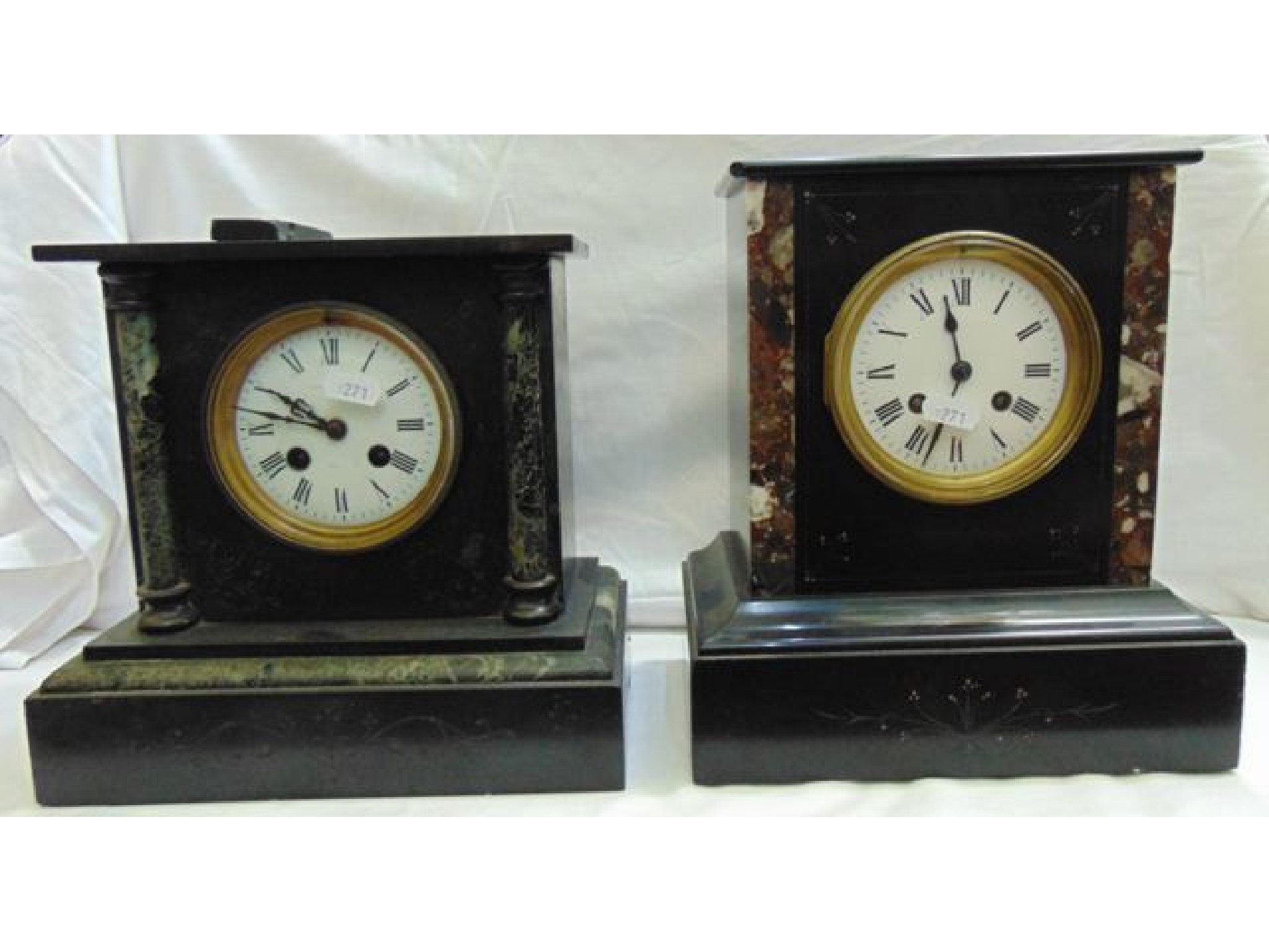 Appraisal: A Victorian black slate and polished marble mantle clock with