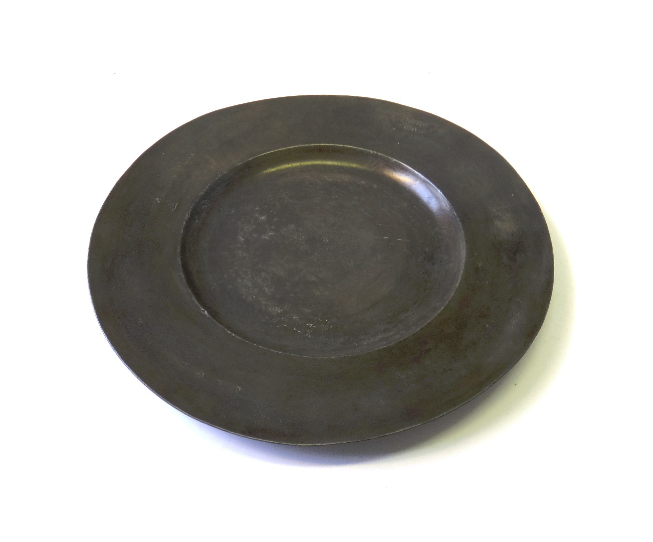 Appraisal: An English pewter broad rimmed dish by George Smith of