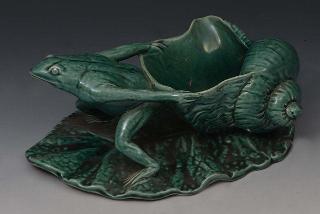 Appraisal: A WATCOMBE GLAZED POTTERY MODEL OF A FROG pulling a