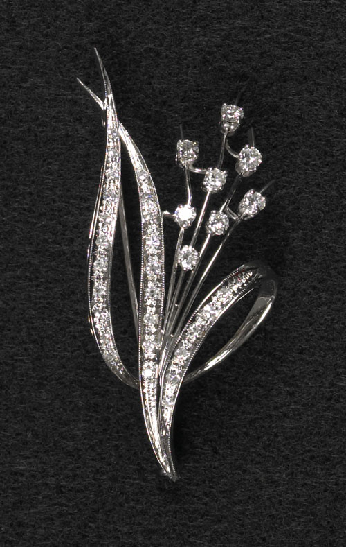 Appraisal: K white gold and diamond sprig brooch containing full and