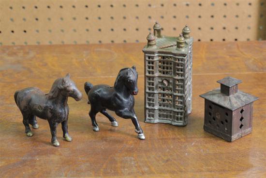 Appraisal: FOUR CAST IRON BANKS Two horses '' h A skyscraper