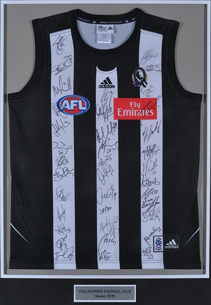 Appraisal: COLLINGWOOD AFL JERSEY SIGNED BY TEAM FRAMED