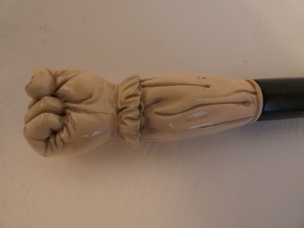 Appraisal: BONE CLENCHED FIST CANE Antique cane with carved bone clenched