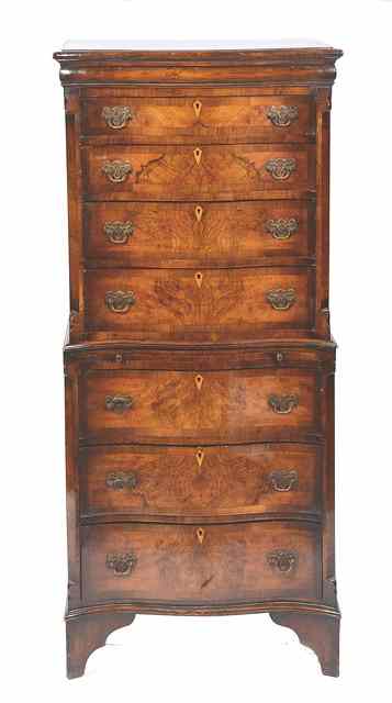 Appraisal: AN TH CENTURY STYLE WALNUT VENEERED SERPENTINE TALL CHEST constructed