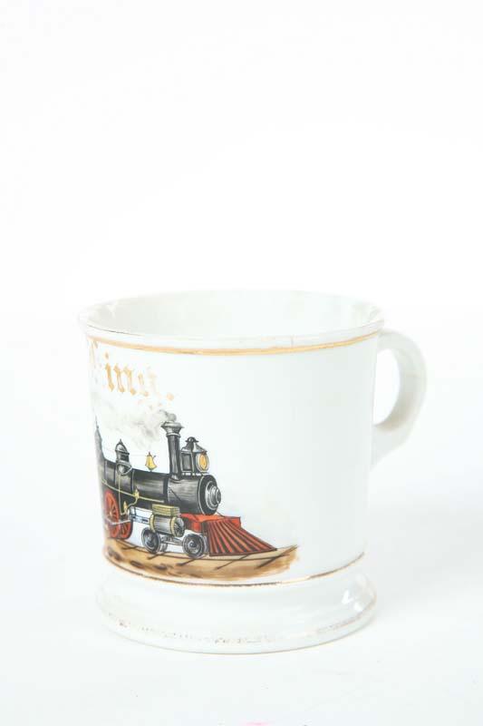 Appraisal: OCCUPATIONAL SHAVING MUG Train conductor's mug with an engine pulling