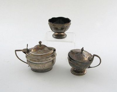 Appraisal: A George III silver mustard pot oval bellied form scroll