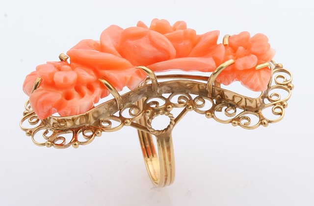 Appraisal: KY free form carved pink coral Floral motif Size gms