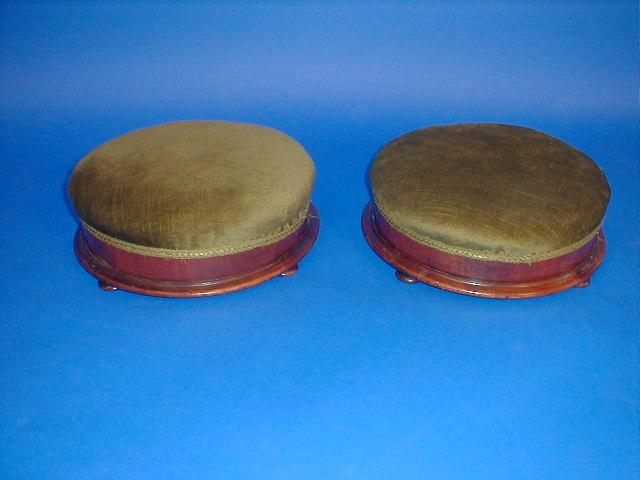 Appraisal: A pair of Victorian mahogany circular footstools with bun feet