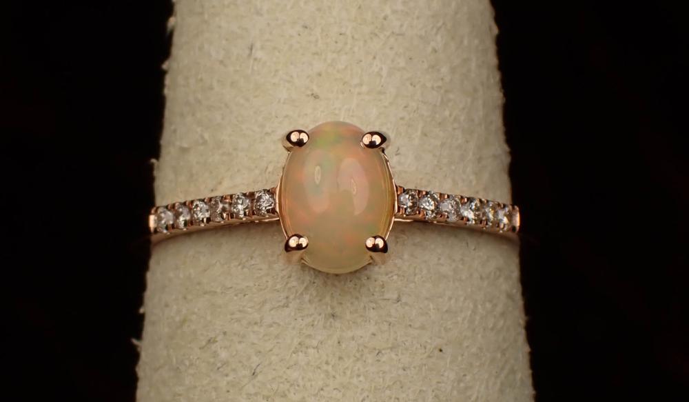 Appraisal: OPAL DIAMOND AND FOURTEEN KARAT GOLD RING The rose gold