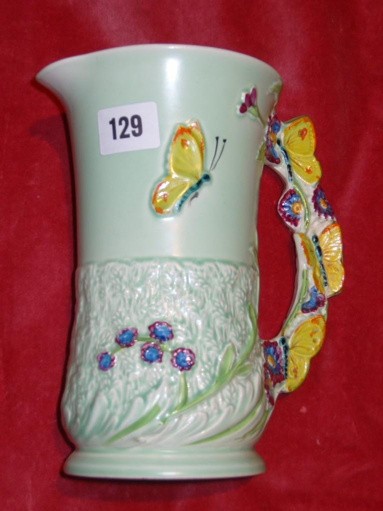 Appraisal: A Burleigh ware green ground jug with moulded and painted