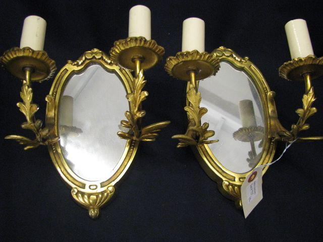 Appraisal: Pair of French Brass Wall Sconces double light oval mirrored