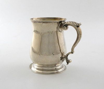 Appraisal: A George II III silver mug of baluster form leaf