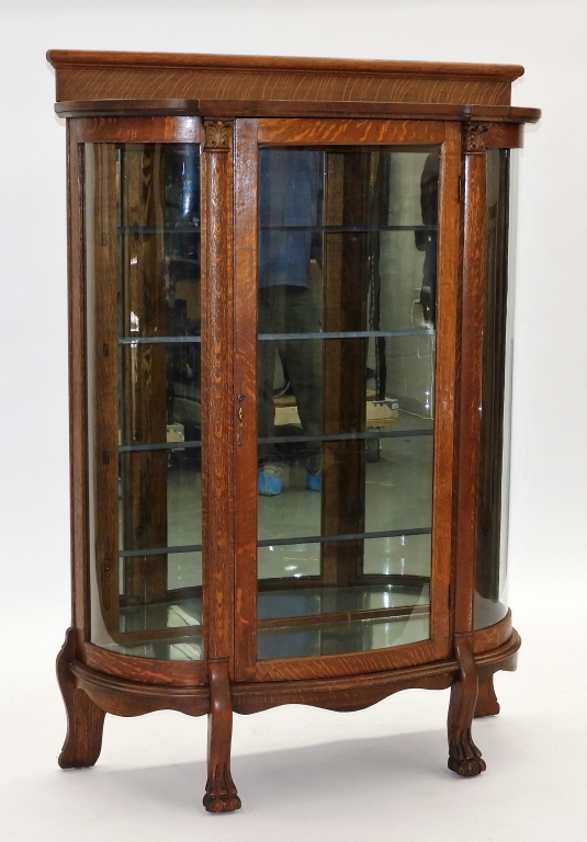 Appraisal: C AMERICAN OAK CURVED GLASS CHINA CABINET United States Circa