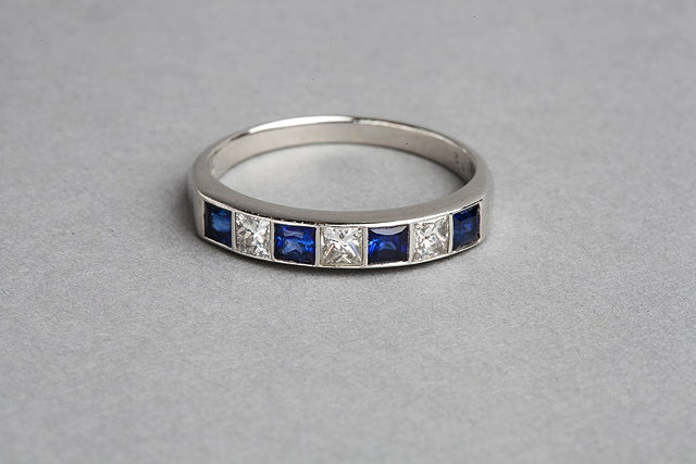 Appraisal: A SAPPHIRE AND DIAMOND SET HALF ETERNITY RING set with