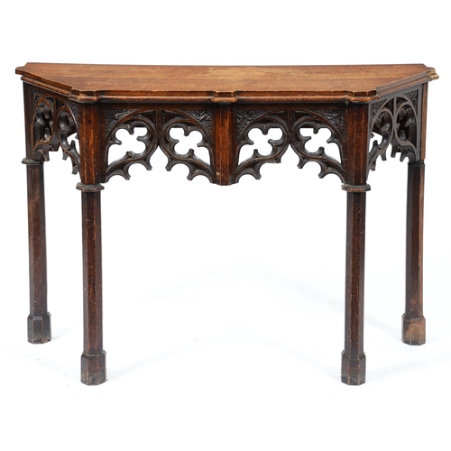 Appraisal: A Victorian gothic oak side table with carved pierced apron