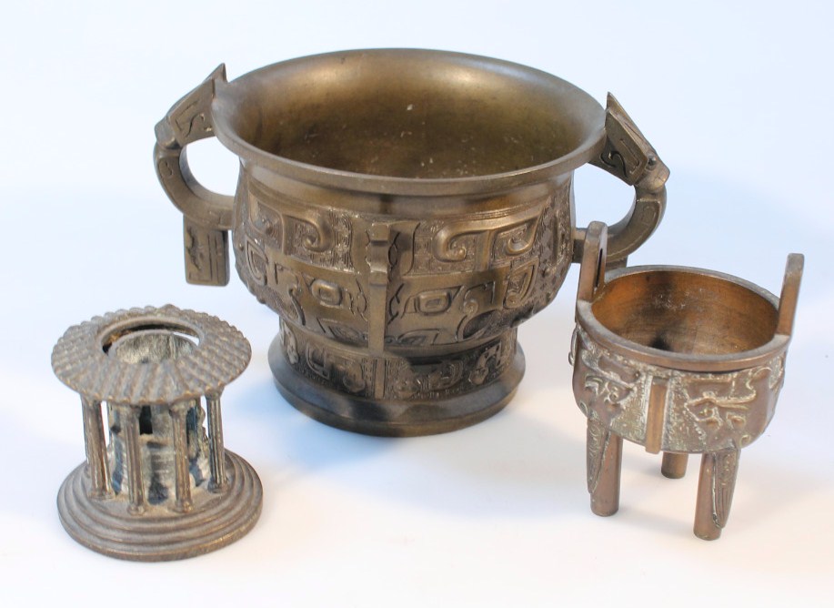 Appraisal: A thC oriental designed bronzed censer with two handles the