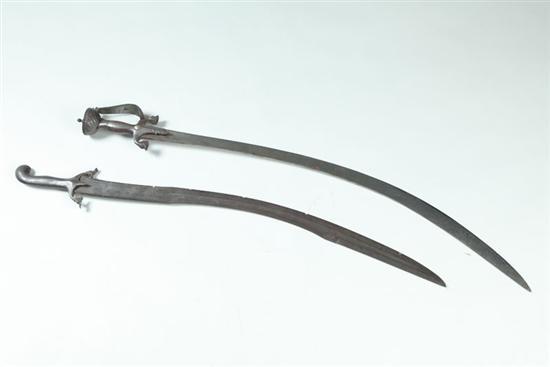 Appraisal: TWO SWORDS Middle Eastern th century Curved blades with steel