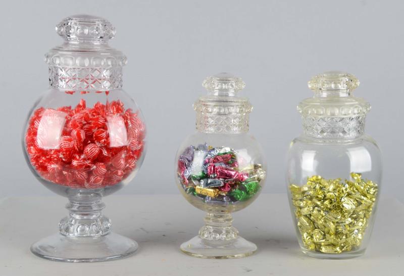 Appraisal: Lot Of Glass Countertop Candy Display Jars All jars have