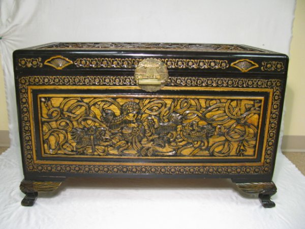 Appraisal: Large Chinese decorative carved cedar chest with tray All four