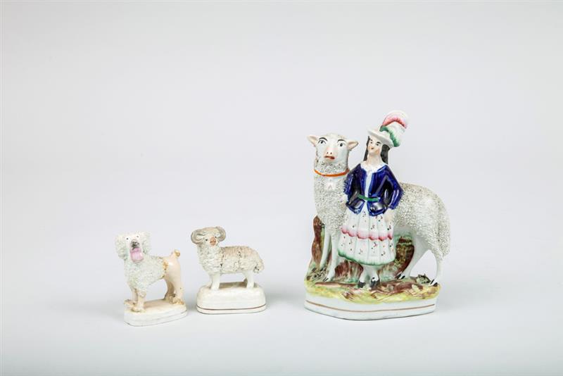 Appraisal: Three Staffordshire Porcelain Figures Comprising a shepherdess with giant sheep