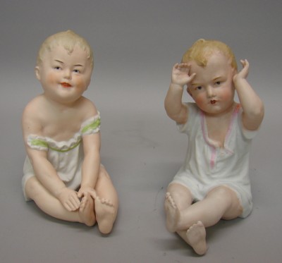 Appraisal: -Marked Heubach piano babies Pair of sitting boy babies both