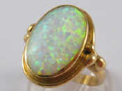 Appraisal: A carat gold opal doublet ring approx cm long ring