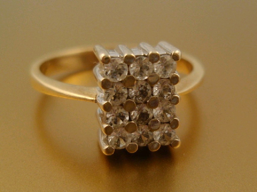 Appraisal: A white sapphire set ring a block of twelve x