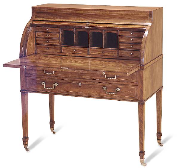 Appraisal: A Georgian style mahogany cylinder desk With a well fitted