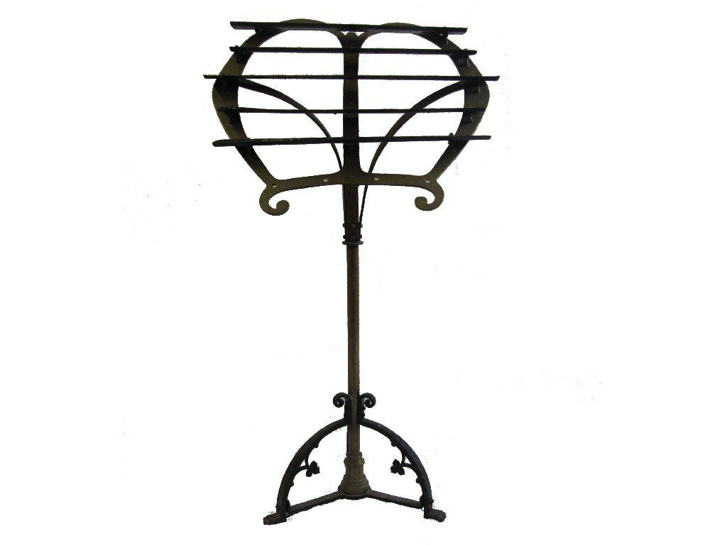 Appraisal: A brass and wrought iron candlestand with five tiers for