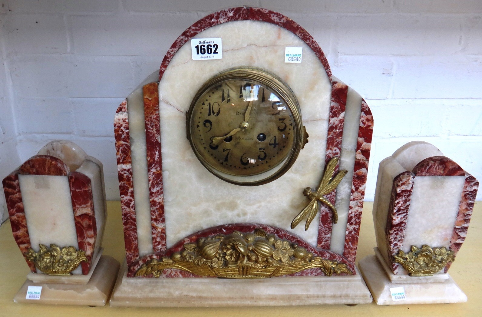 Appraisal: An Art Deco marble clock garniture the two tone clock