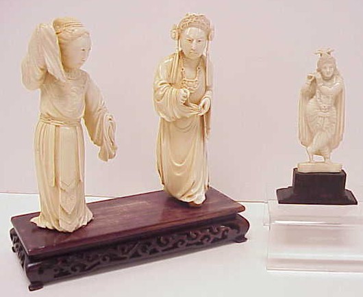 Appraisal: Three Asian carved figures including a pair of ivory actors