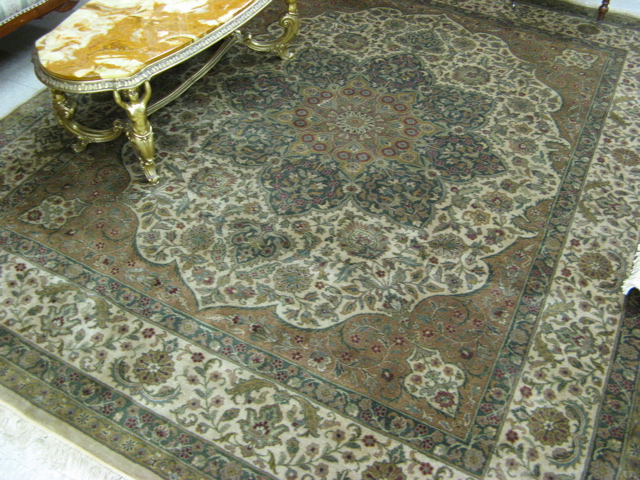 Appraisal: HAND KNOTTED ORIENTAL CARPET Indo-Persian overall floral design on centralized