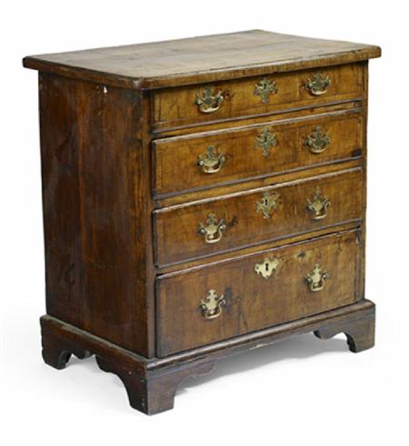 Appraisal: An early th century walnut and crossbanded chest the rounded