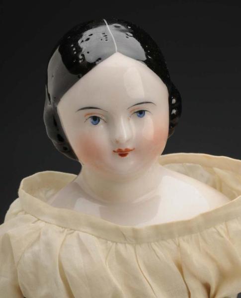 Appraisal: China Head Lady with Covered Wagon Hairdo Description Germany Ca