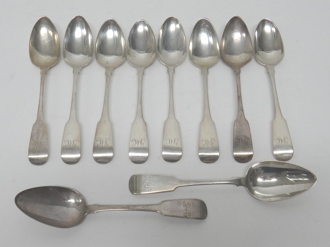 Appraisal: Eight Irish silver fiddle pattern dessert spoons monogram engraved Dublin