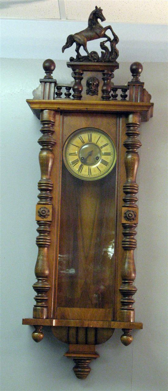 Appraisal: Early twentieth century walnut Vienna regulater wall clock the top