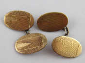 Appraisal: A pair of Art Deco silver cufflinks gold fronts circa