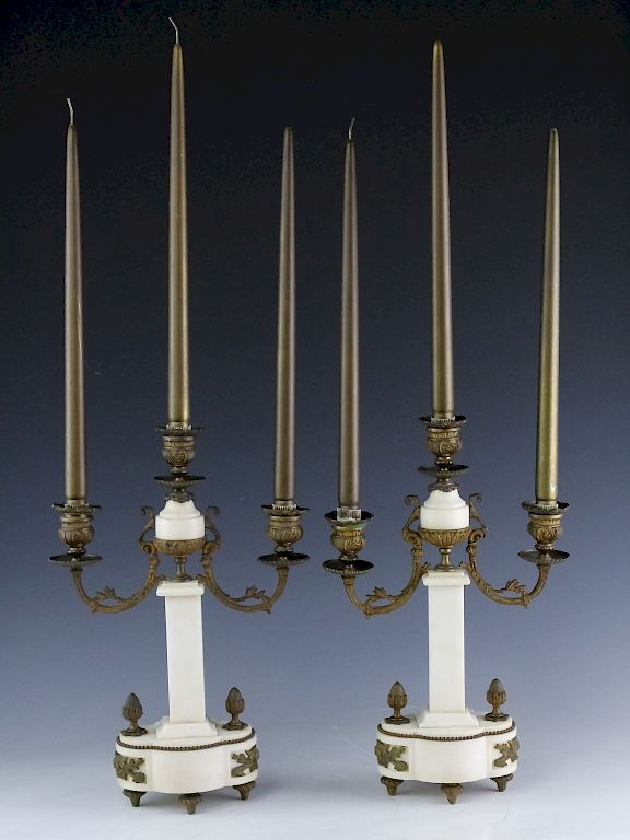 Appraisal: Pair Of Bronze White Marble Candelabras Pair of Hollywood Regency