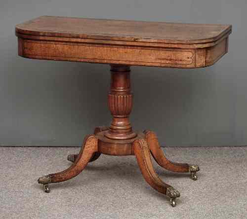 Appraisal: A George IV figured mahogany D-shaped card table the baize