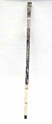 Appraisal: A CHINESE CARVED BONE WALKING CANE scrimshawed with man standing