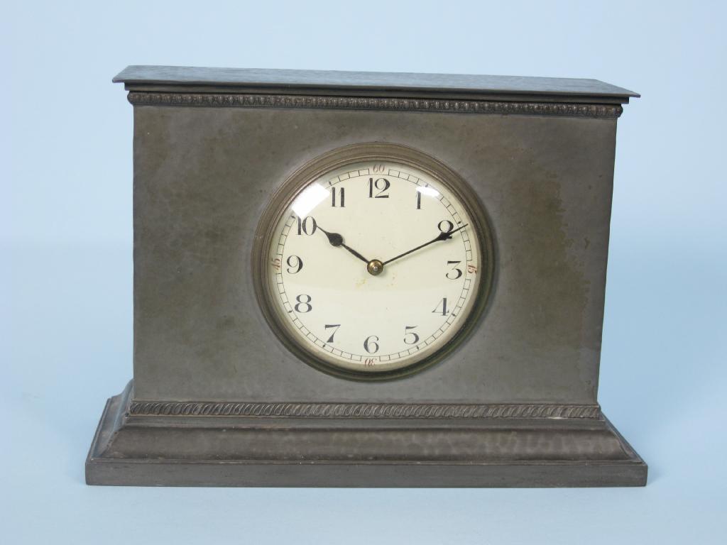 Appraisal: A Liberty pewter cased Mantel Clock with hammered design in