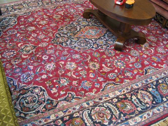 Appraisal: PERSIAN MASHAD CARPET northeastern Iran central medallion and scrolling floral