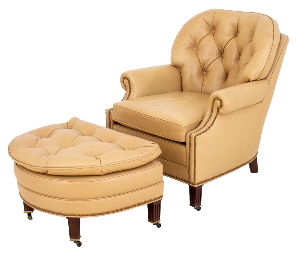 Appraisal: UPHOLSTERED LEATHER ARM CHAIR AND OTTOMAN Upholstered light coffee-colored leather