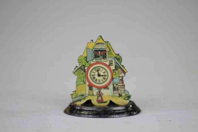 Appraisal: CLOCK TOWER PENNY TOY Lithographed tin depicts cottage with large