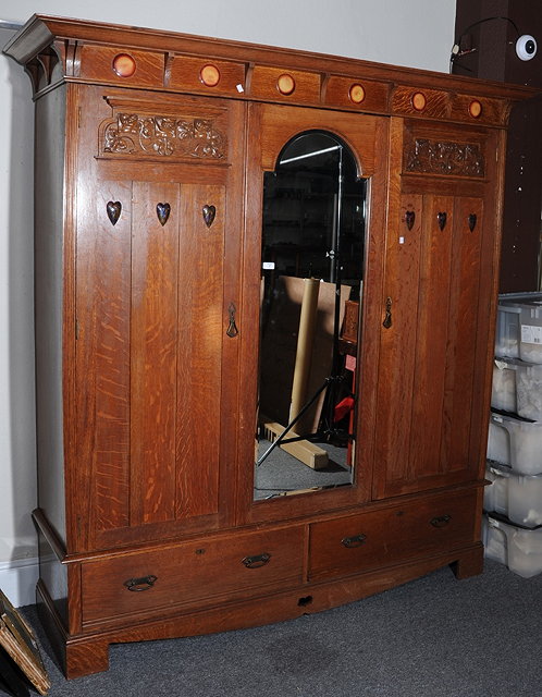 Appraisal: A SHAPLAND PETTER OAK ARTS AND CRAFTS WARDROBE with central