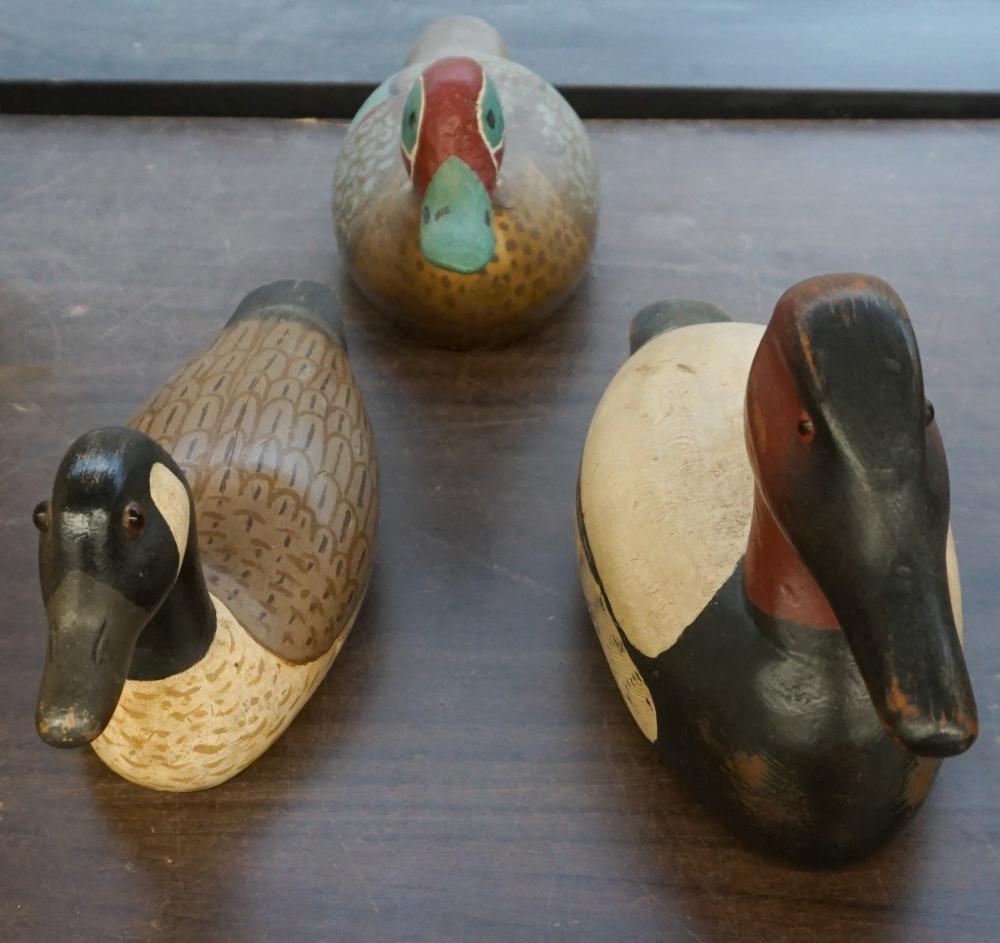 Appraisal: TWO CARVED AND DECORATED WOOD AND ONE PLASTER DUCK DECOYS